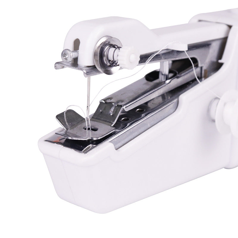Hand-held portable sewing machine